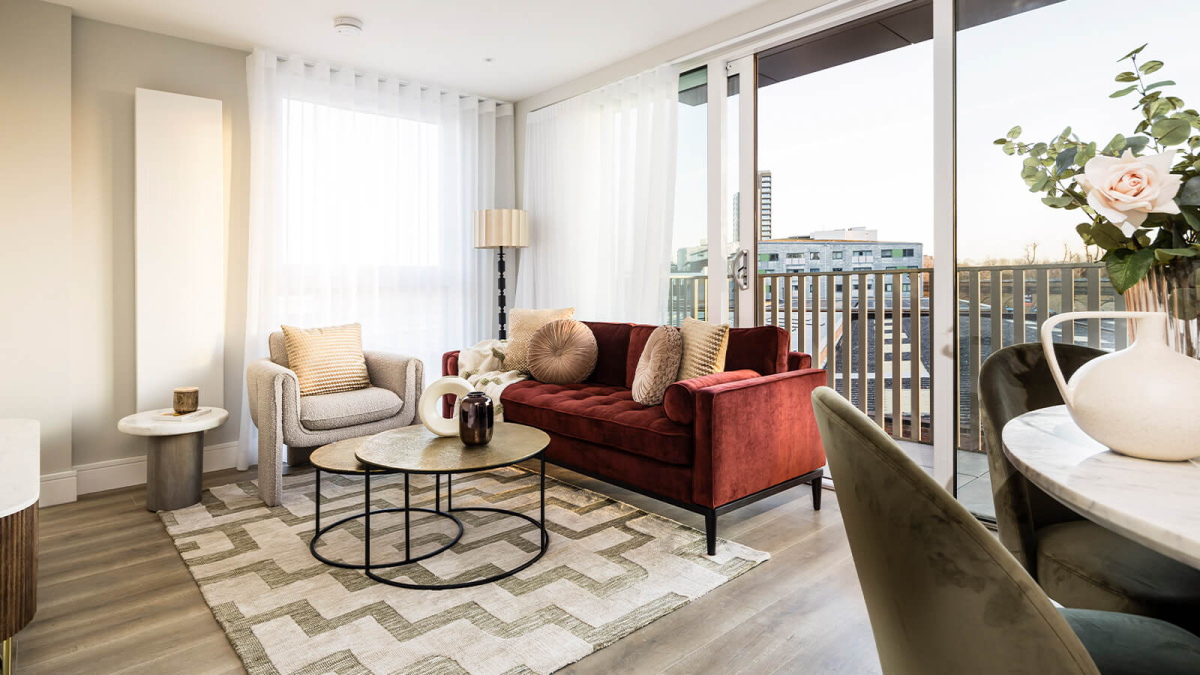Living area with adjoining balcony at Neptune Wharf ©Galliard Homes.
